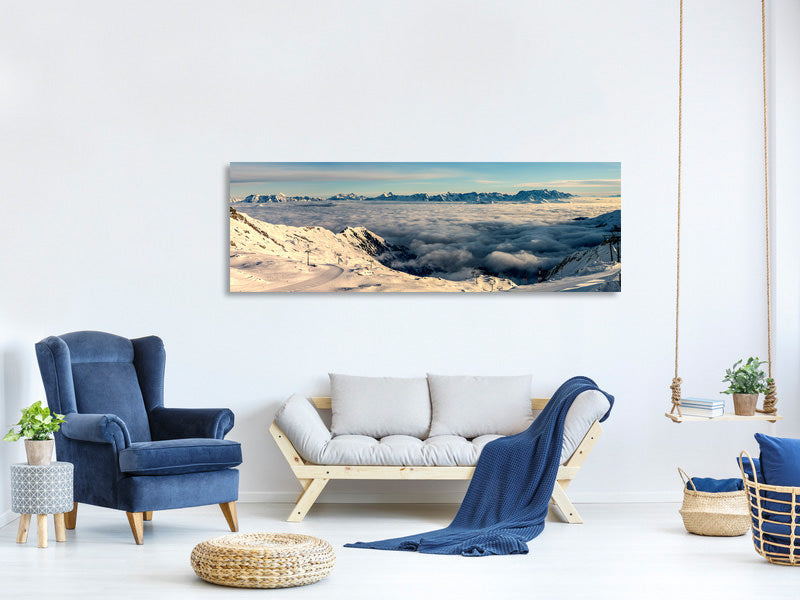 panoramic-canvas-print-above-the-clouds-in-the-snow